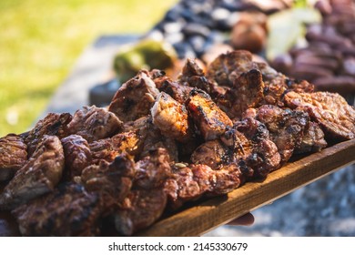 Freshly grilled sweetbreads served on wooden tray                    