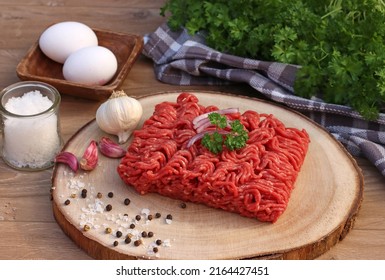 Freshly Ground Minced Meat On A Wooden Board.