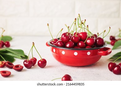 Freshly harvested cherries in a bowl. Fresh sweet organic cherries in a red bowl. - Shutterstock ID 2164459835