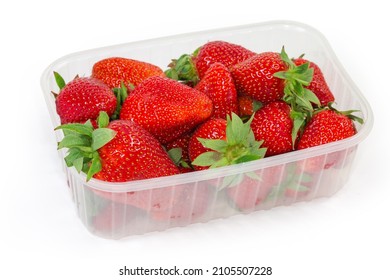 Freshly Harvested  Ripe Garden Strawberries In Packing In The Form Of Translucent Food Container On A White Background, Close-up In Selective Focus
