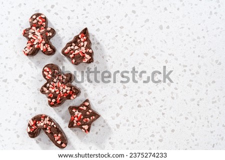 Freshly made Christmas cookie-cutter peppermint fudge on the kitchen counter.