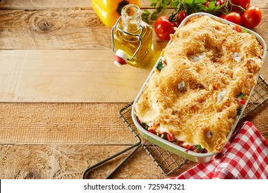 Freshly Made Dish Of Italian Vegetable Lasagne With Assorted Fresh Veggies Layered With Pasta And Mozzarella And Topped With Grated Cheese Viewed From Above With Copy Space