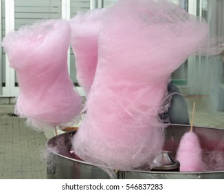 Freshly made pink cotton candy being shown for Sale