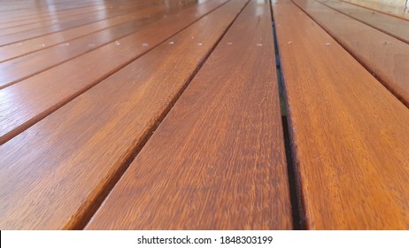 Freshly oiled Australian spotted Gum timber outdoor covered deck with Merbau stain at Residential Home, still wet and yet to dry