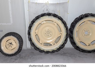 Freshly painted rims in a light color from a farm tractor standing in the hall. - Powered by Shutterstock