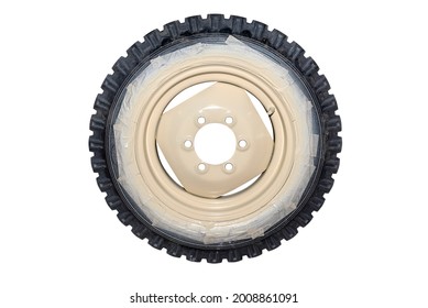 Freshly painted rims in a light color from a farm tractor, isolated on a white background with a clipping path. - Powered by Shutterstock