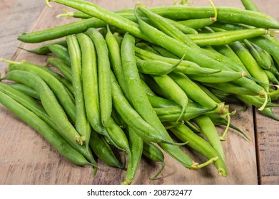 Freshly Picked Green Or Snap Beans On A Wooden Table