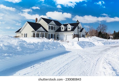 A Freshly Plowed Road In America Suburbia After A Snow Storm.