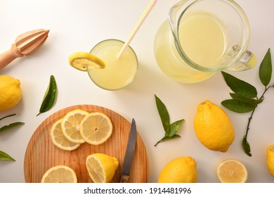 Freshly Prepared Lemon Juice With Utensils On The White Kitchen Bench. Top View. Horizontal Composition.