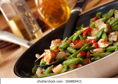Freshly prepared mixed vegetables with gourmet herb sauce in eco friendly ceramic coated skillet.  Closeup with shallow dof.  Selective focus on veggies in spoon. - Powered by Shutterstock - Get 15% off with code: PIKWIZARD15