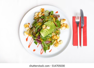 Freshly Prepared Salad With Avocado And Halloumi, Top Down View, Isolated On White