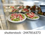 Freshly Prepared Salads on Display in a Cafeteria During Lunchtime