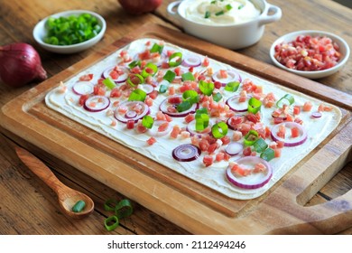 Freshly Prepared Tarte Flambée On Wooden Board