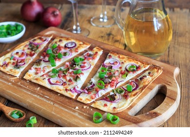 Freshly Prepared Tarte Flambée On Wooden Board