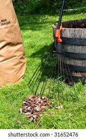 Freshly Raked Backyard, With Rake, Leaves And Recycling Yard Waste Paper Bag