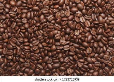 Freshly roasted coffee beans background - Shutterstock ID 1723723939