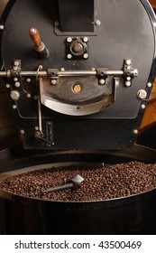 The Freshly Roasted Coffee Beans From A Large Old Coffee Roaster Being Stirred In The Cooling Cylinder.