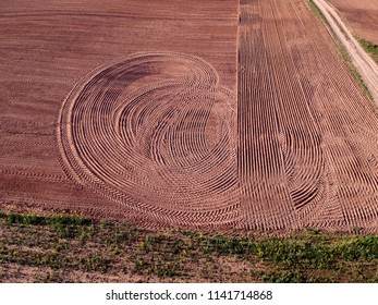 Freshly sowed cultivated spring time agriculture field, aerial view