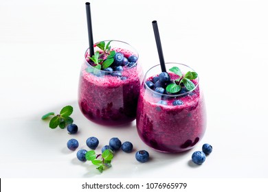 Freshly Squeezed Blueberry Juice On The Table. A Healthy Summer Drink In Two Glasses.