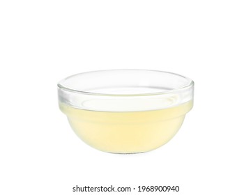 Freshly Squeezed Lemon Juice In Glass Bowl Isolated On White