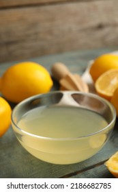 Freshly Squeezed Lemon Juice In Glass Bowl On Table