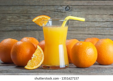 Freshly Squeezed Orange Juice In Glass With Orange Fruits On Wooden Background, Bitter Seville Fresh Oranges Citrus Fruit Concept