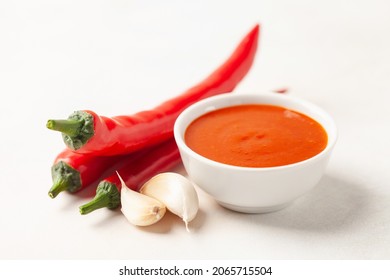 Freshly Sriracha Hot Chilli Sauce In Bowl On The Table.