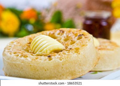 Freshly Toasted Crumpet With Melting Butter On A Plate