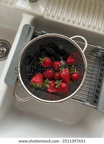 freshly washed strawberries and blackberries 