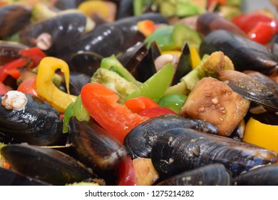 Freshwater Boiled Mussels Cooking As A Stir Fry With Organic Vegetables In A Large Silver Wok 