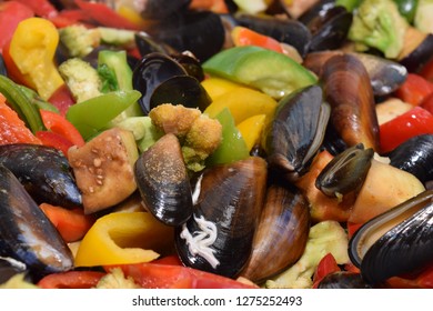 Freshwater Boiled Mussels Cooking As A Stir Fry With Organic Vegetables In A Large Silver Wok 