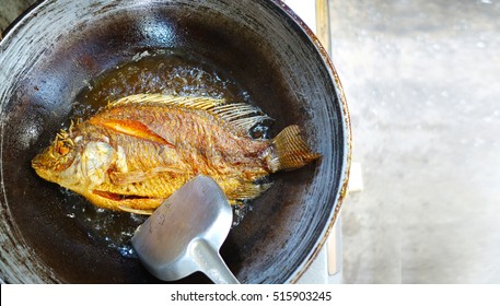 freshwater fish fried in a pan