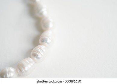 Freshwater Ringed Pearls.  The Pearls Are White In Color With An Irregular Oval Shape And Irregular Ring Pattern.