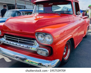 FRESNO, UNITED STATES - Apr 03, 2021: A Close Up Front View Of A Gorgeous Classic Chevrolet Red Orange Pickup Truck At A Car Show Outside In Ca  2021