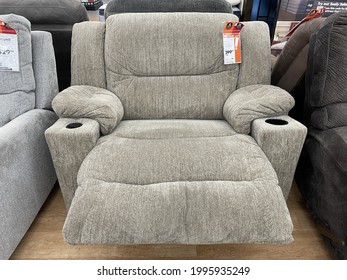 FRESNO, UNITED STATES - Jun 19, 2021: A Photo Of A New Light Colored Plush Oversized Recliner Chair With Cup Holders In Store