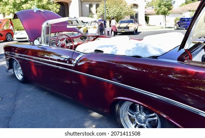 FRESNO, UNITED STATES - Oct 09, 2021: A Closeup Of A Wine Colored 1965 Classic C-10 Chevy Pickup Truck And White Top With Hood Up