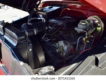 FRESNO, UNITED STATES - Oct 09, 2021: A Closeup Of A Wine Colored 1965 Classic C-10 Chevy Pickup Truck And White Top With Hood Up