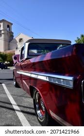 FRESNO, UNITED STATES - Oct 09, 2021: A Closeup Of A Wine Colored 1965 Classic C-10 Chevy Pickup Truck And White Top With Hood Up