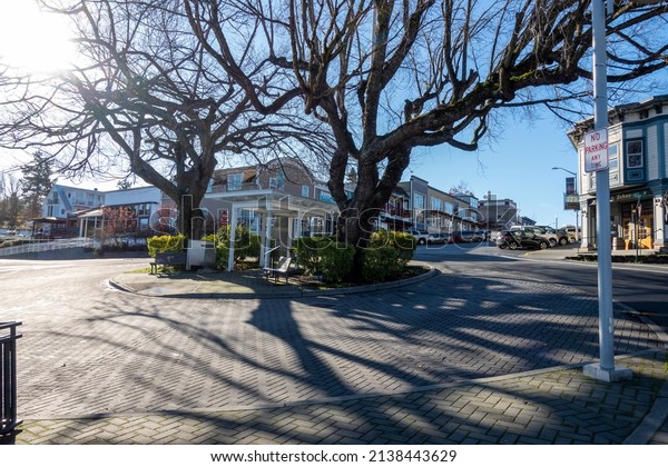 Friday Harbor, WA USA - circa November 2021: View of\
a major intersection in the heart of downtown Friday Harbor on a\
bright, sunny day.