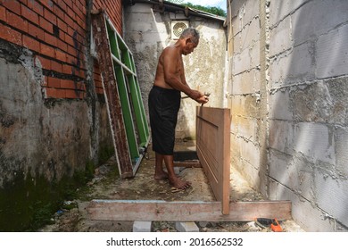 Friday, July,30,2021 Jakarta Indonesia Potrait Old Man Carpenter Making Doors For The House