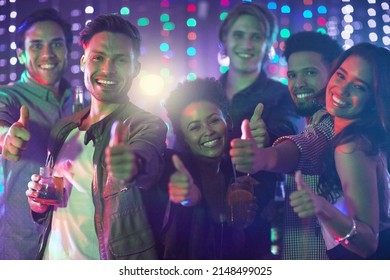 Friday Night Done Right. Portrait Of A Happy Group Of Friends Giving A Thumbs Up While Standing In A Nightclub.