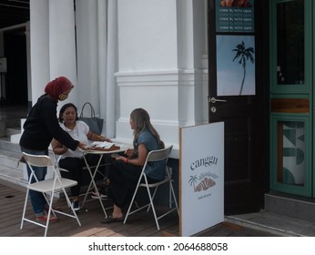 Friday, October 15, 2021. Three Ladies, Aged 40-50 Years Old, Had A Conversation In Canggu Bakehouse, Bali Inspired Bakery And Cafe, Which Located In Pasar Baru Ward, Central Jakarta, Indonesia.