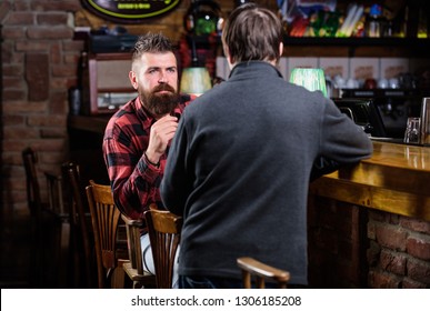 Friday Relaxation In Pub. Friends Relaxing In Pub. Friendly Conversation With Stranger. Hipster Brutal Bearded Man Spend Leisure With Friend Bar Counter In Pub. Men Relaxing In Pub. Weekend Leisure.