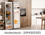 Fridge full of different fresh products in kitchen