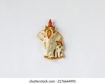 Fridge Magnet Souvenir In Shape Of Two Decorated White And Golden Elephants Isolated On White Background. Travel To Thailand Concept. Top View Flat Lay Close Up, Copy Space