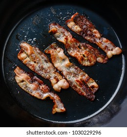 Fried Bacon In Frying Cooking Pan Close-up