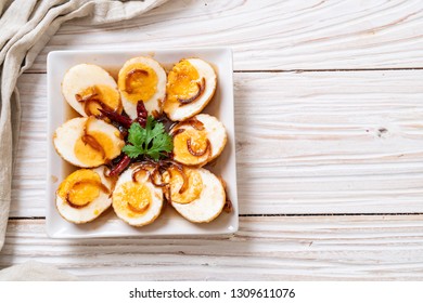 Fried Boiled Egg with Tamarind Sauce or Sweet and Sour Eggs - Shutterstock ID 1309611076