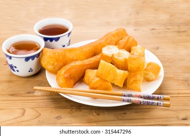 Fried Bread Stick Or You Tiao Served With Chinese Tea