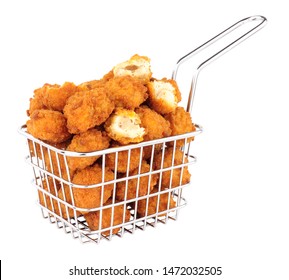 Fried Breadcrumb Covered Chicken Popcorn In A Small Wire Frying Basket Isolated On A White Background