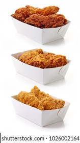 Fried breaded chicken in white cardboard boxes isolated on white background